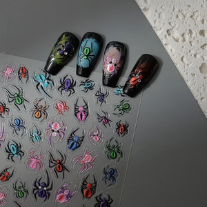 3D colorful spider nail stickers showing glitter textures on long black coffin fake nails