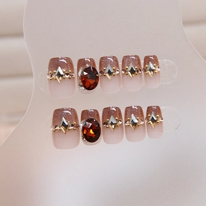 Cat eye gradient press-on nails with red rhinestones and silver crystal accents