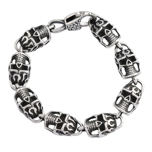 Gothic punk skull link bracelet with oxidized finish and secure clasp on white backdrop