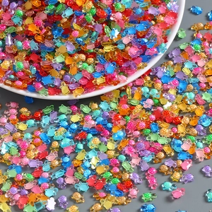 Close-up of colorful mini resin turtles in vibrant mixed colors for creative DIY projects