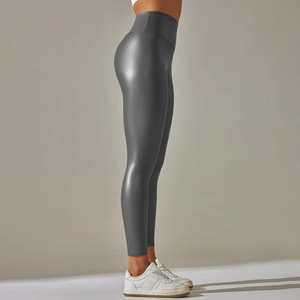 Detailed side view of high-waisted dark grey faux leather leggings with matte finish
