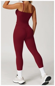 Rear view of burgundy yoga set featuring thin strap top and high-waist leggings