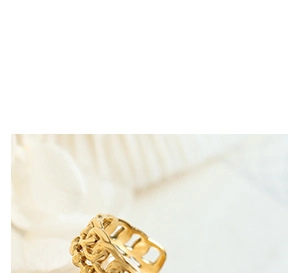 Macro shot of gold hollow lotus flower ring made of titanium steel for women