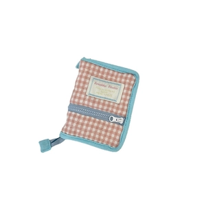 Pink and white checkered quilted mini binder cover with blue zipper and brand label