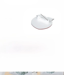 Detail view of the back of an acrylic badge with a secure white plastic pin backing
