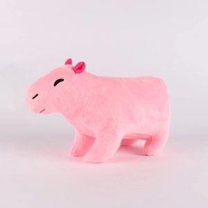 Detailed close-up of a pink plush capybara toy with soft fur texture on white background