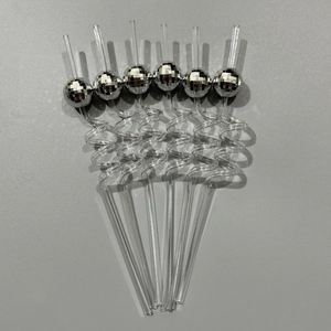 Set of 6 silver disco mirror ball spiral straws for party decor on a grey background