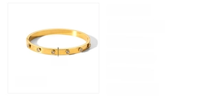 Detailed view of 6mm wide 18k gold plated stainless steel bracelet with cubic zirconia