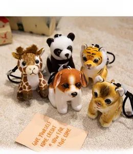 Set of five plush animal keychains including panda and tiger on soft textured background