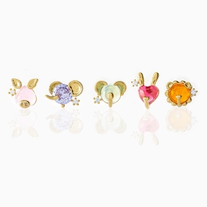 Golden cartoon animal stud earrings with colorful gemstones and mirror reflection