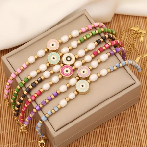 Detailed shot of evil eye beaded bracelets with pearls on a jewelry display box