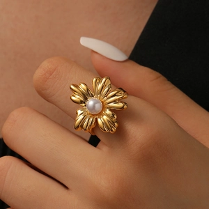 18K gold plated flower ring with pearl center on finger, elegant petal jewelry for women