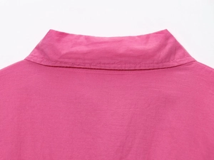 Detail of double-stitched collar on rose pink blouse with premium cotton texture