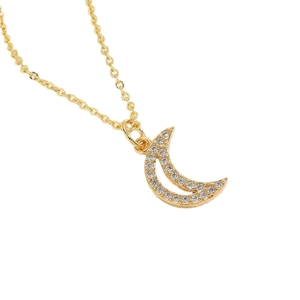 Elegant gold crescent moon pendant necklace with pavé white zircon stones on white background