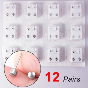 Set of 12 pairs stainless steel heart-shaped ear piercing studs with sharp tip detail
