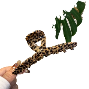 Elegant leopard print hair claw clip in acetate with gold Barrette La France lettering