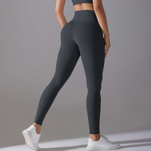 Detail of high-waisted dark grey yoga leggings with seamless lifting and shaping design