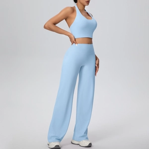 Light blue yoga set featuring a halter sports bra and high-waisted wide leg pants