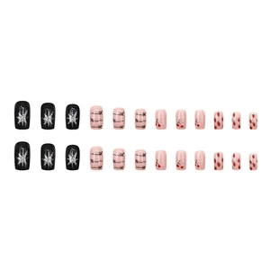 24-piece press-on nails set featuring cartoon cherry, bow, and star patterns in pink and black