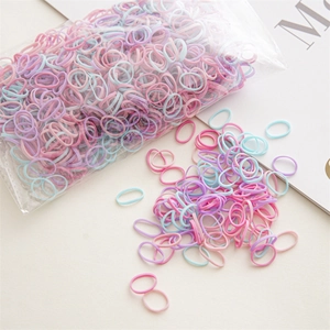 Detailed macro view of colorful high-elastic disposable hair bands in soft macaron shades