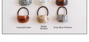 Detail of assorted tortoiseshell acetate hair ties in caramel and marble textures