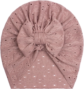 Detailed texture of dusty pink mesh baby turban hat with a large decorative bow