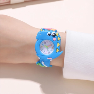 Detail of blue silicone kids watch band featuring 3D dinosaur embossing and dino text