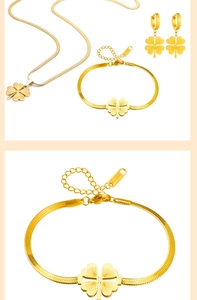Detailed view of lucky clover jewelry set featuring a gold snake chain bracelet and necklace