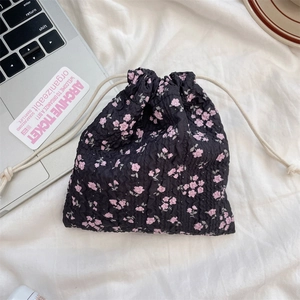 Detail showing pink floral bubble texture fabric and white cotton drawstring closure