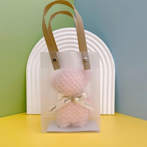 Pink plush bear towel in a frosted PVC gift bag with brown handles and a Just for you ribbon