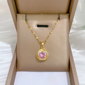 Detail of pink zircon pendant on gold chain set in a luxury velvet jewelry gift box