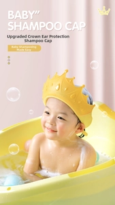 Detail of adjustable crown baby shampoo cap with ear protection in bright yellow