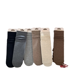Six pairs of ribbed cotton crew socks in earth tones like brown, grey, and beige