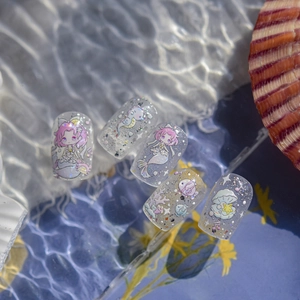 Ocean theme press-on nails with mermaid illustrations and glitter for children