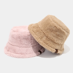 Warm plush bucket hats in pink and khaki with leather tag for winter outdoor wear