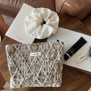 Handmade brown cotton linen cosmetic bag with white floral embroidery and storage pouch
