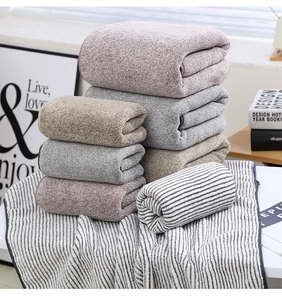 Close-up of thick bamboo charcoal coral fleece towel set with soft microfiber texture