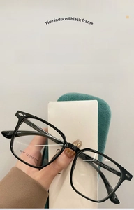 Close-up of black square frame glasses showing anti-blue light lens and model 5037 specs