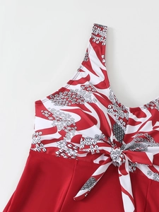 Close-up of red floral print tankini top with central bow detail and v-neckline