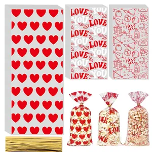 Valentine candy bags with red heart patterns and gold twist ties for snacks