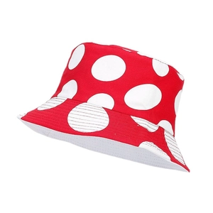 Reversible red fisherman hat with white polka dot mushroom pattern for sun protection