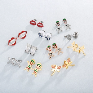 Minimalist stainless steel stud earrings set featuring dragonfly and red lip designs