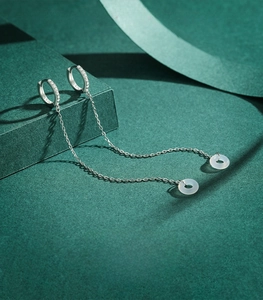 Detail of S925 sterling silver long chain earrings with translucent white rings