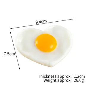 Heart-shaped fried egg PVC model keychain ornament with detailed measurements and size specs