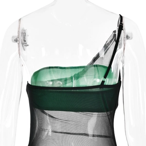 Detail view of the black mesh and green panel back design on the three-piece dress set