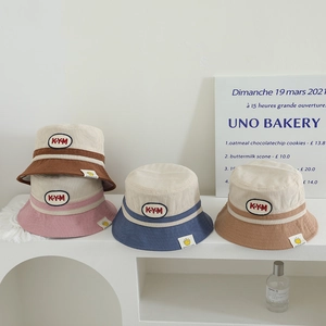 Corduroy bucket hats for kids featuring embroidery and stylish contrast color combinations