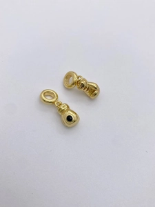 Detailed view of gold-plated boxing glove pendants with S925 hallmark and black accents