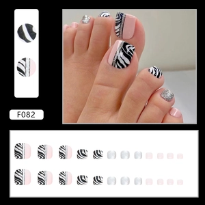 Colorful floral press-on toe nails with zebra print and silver glitter accents