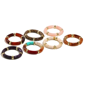 Detailed set of seven bohemian acrylic resin bangles with leopard print and marble patterns