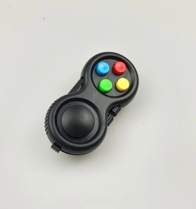 Close-up of stress relief game controller toy with colorful silicone buttons on white background